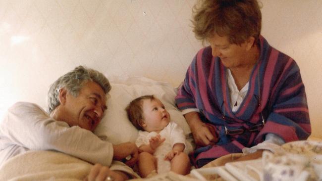 “Morning with family in bed. It was a family tradition to pile on Mum and Dad’s bed on the weekend morning to read the papers and muck about. The tradition continued in The Lodge. This is mid-1983 and my daughter Sophie is with her Nan and Pop.” - Sue Pieters-Hawke