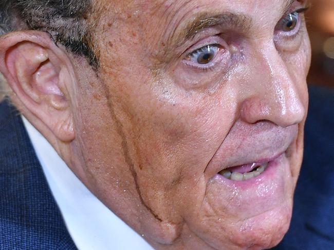 Rudy Giuliani’s infamous media conference hair dye meltdown. Picture: AFP