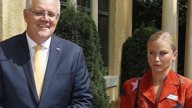 Grace Tame appears visibly uncomfortable as she stands for a picture with Scott Morrison. Picture: Gary Ramage/NCA NewsWire.