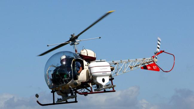 02 Apr 2004 Helicopter similar to the Bell 47 Helicopter from McDermott Aviation which crashed at Schultz Canal at Nudgee Beach today. Picture: Darren/England helicopters