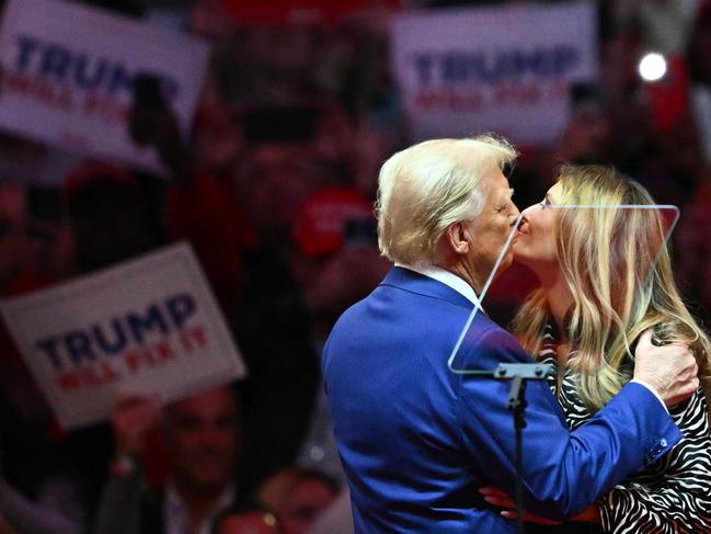 Donald Trump kisses former first lady Melania Trump at Madison Square Garden in New York. Picture: AFP