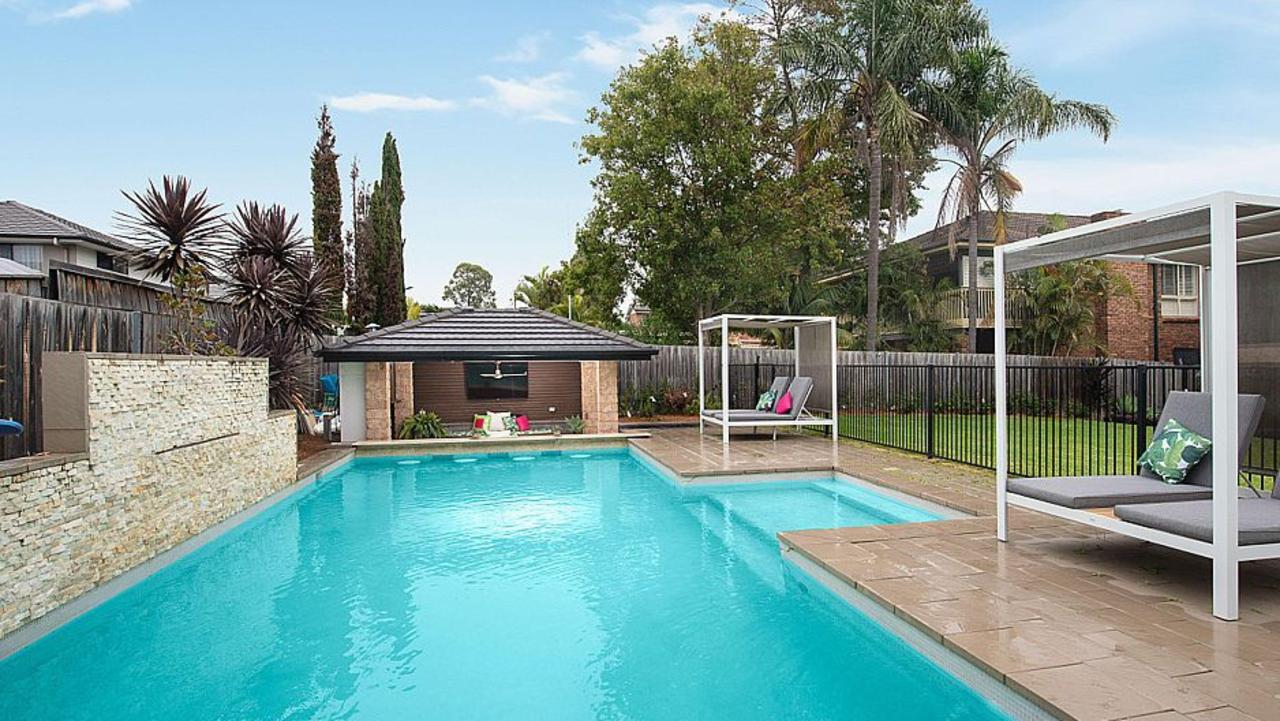 Camilla Flower, wife of Damion, auctions her home at Elouera Crescent, Moorebank. Picture: Supplied