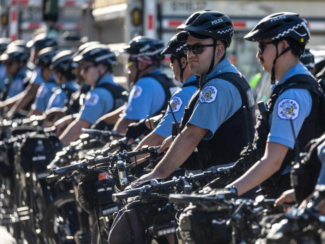 Chicago police watch as protesters gather ahead of the Democratic National Convention. Picture: Getty Images via AFP