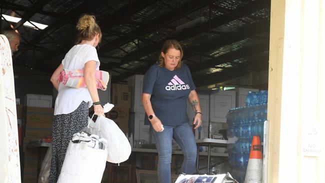 Proprietor of Used Furniture Karen Willott receiving donations from Hervey Bay Tai Chi with the help of volunteer Heather Fletcher. Picture Cath Piltz