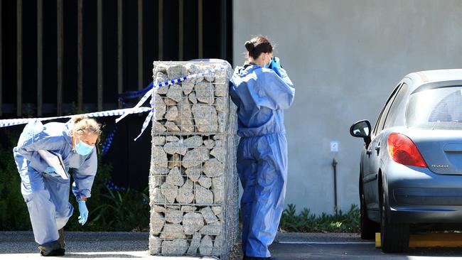 Police set up a second crime scene and inspect a vehicle at Mernda police station. Picture: Mark Stewart