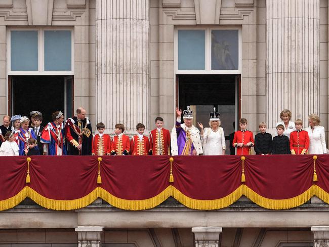 Britain's King Charles III wearing the Imperial state Crown, and Britain's Queen Camilla wearing a modified version of Queen Mary's Crown join other members of the Royal Family on the Buckingham Palace balcony while viewing the Royal Air Force fly-past in central London on May 6, 2023, after their coronations. - The set-piece coronation is the first in Britain in 70 years, and only the second in history to be televised. Charles will be the 40th reigning monarch to be crowned at the central London church since King William I in 1066. (Photo by Oli SCARFF / AFP)