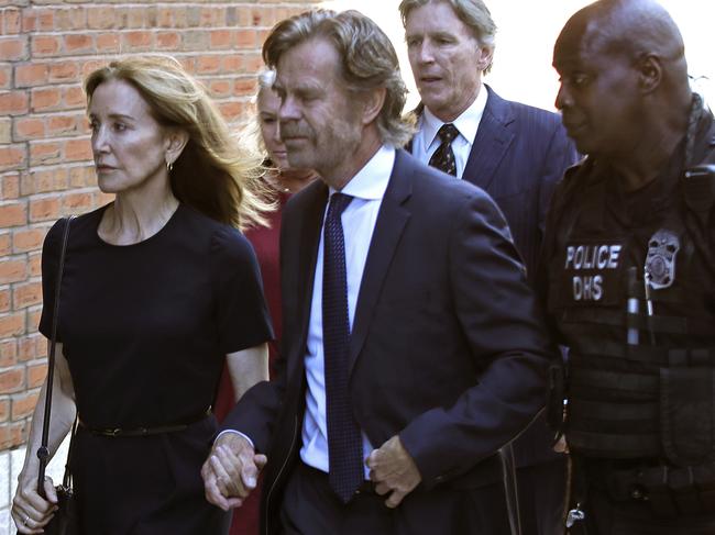 Felicity Huffman arrives at federal court with her husband William H. Macy and her brother Moore Huffman Jr. Picture: AP