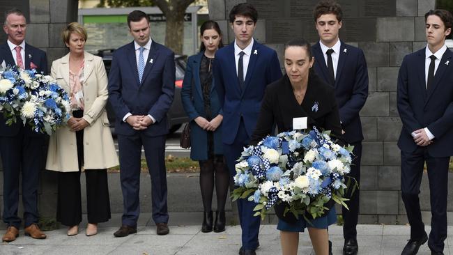 Sharron Mackenzie lays a wreath for her partner, Kevin King. Picture: NCA NewsWire/Andrew Henshaw