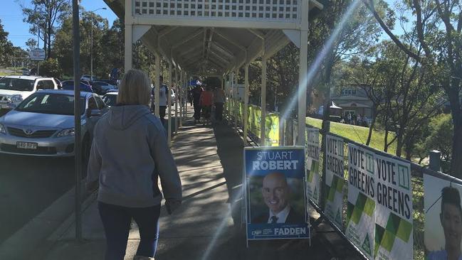 Fadden voters running the gauntlet at Arundel State school around 1.30pm.