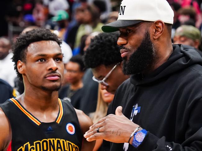 HOUSTON, TEXAS - MARCH 28: Bronny James #6 of the West team talks to Lebron James of the Los Angeles Lakers after the 2023 McDonald's High School Boys All-American Game at Toyota Center on March 28, 2023 in Houston, Texas. (Photo by Alex Bierens de Haan/Getty Images)