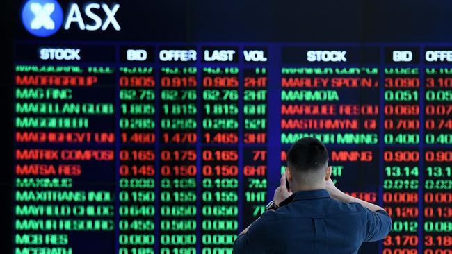 SYDNEY, AUSTRALIA - NCA NewsWire Photos AUGUST, 12, 2020: A man takes a photo of the digital market board at the Australian Stock Exchange (ASX) in Sydney. Picture: NCA NewsWire/Bianca De Marchi