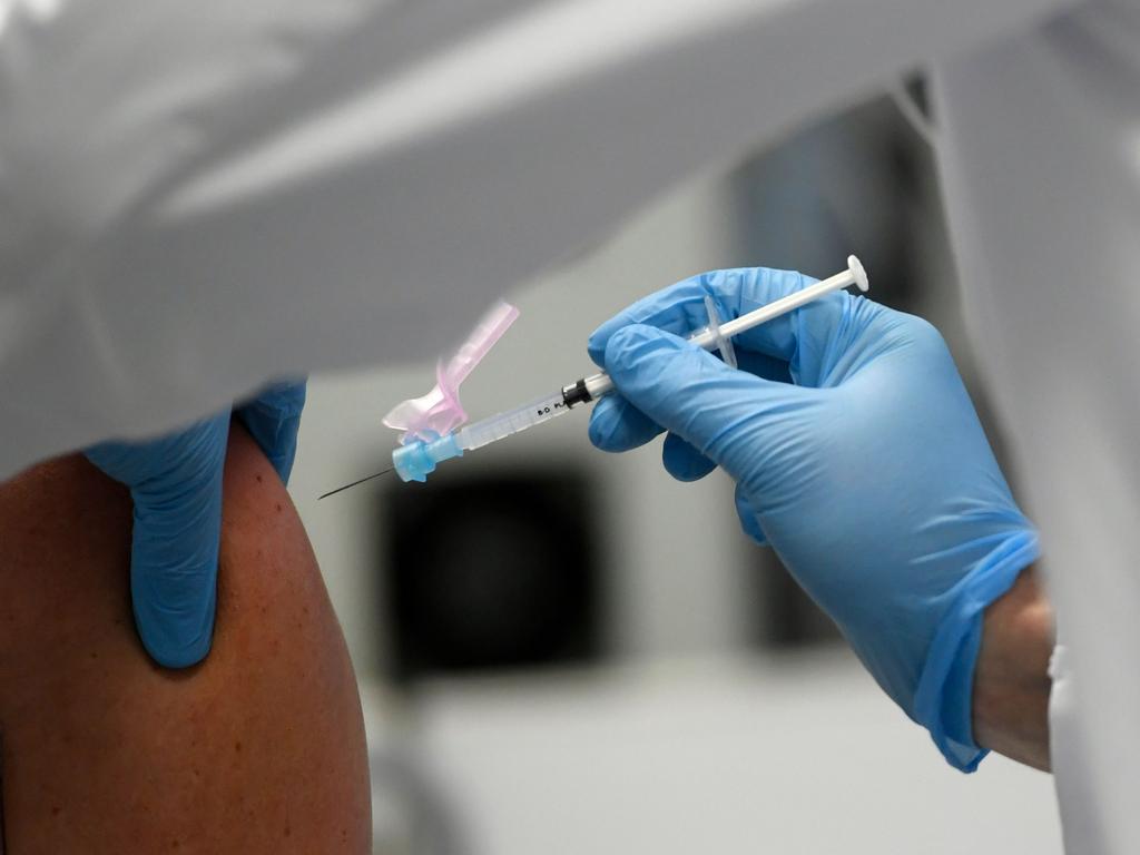 A doctor vaccinates a hospital staff member with an injection of the Moderna COVID-19 vaccine. Picture: Ina Fassbender/AFP