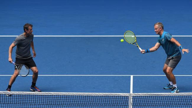 Thomas Johansson (right) of Sweden and Mats Wilander (left) of Sweden in action on day six of the Australian Open. Picture: AAP.