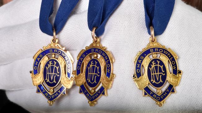 A close-up look at Dick Reynolds’ three Brownlows, which are up for auction. Picture: Jay Town