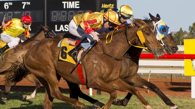 XXXX Gold Kalgoorlie Cup Race Meet - 20/09/14 Kalgoorlie-Boulder Eddie Creighton onboard #6 True Gold (outside) edges out Friarday (Shaun McGruddy) to win the 2014 Kalgoorlie Cup. Photo: TRAVIS ANDERSON