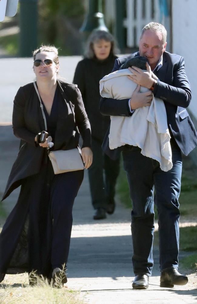 Barnaby Joyce and Vikki Campion head for a cafe with baby Sebastian wrapped up against a cold New England day earlier this month. Picture: Diimex