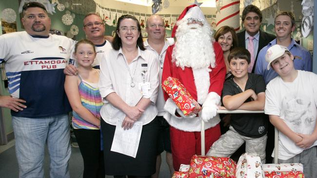 Rouse Hill Renegades handing out presents to patients in the Commercial Travellers Ward at The Children's Hospital at Westmead.