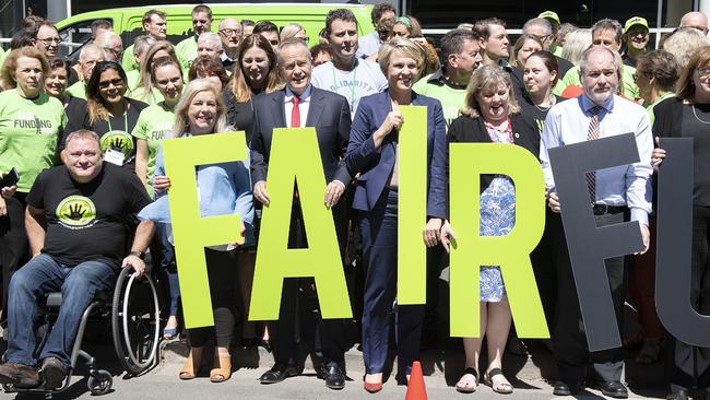 Opposition Leader Bill Shorten and Labor Education spokeswoman Tanya Plibersek pose for photos with delegates outside the Australian Education Union's annual federal conference yesterday Picture: AAP