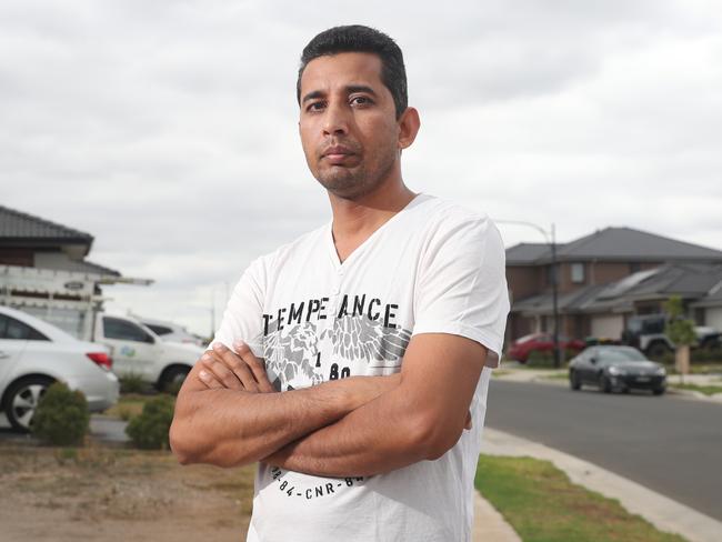 Resident Sandeep Kumar claims land is dropping under his driveway. Picture: Richard Dobson