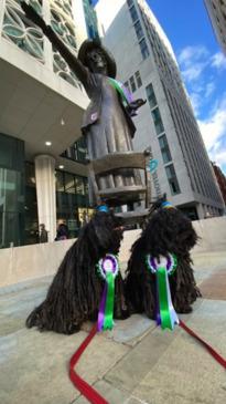 Dogs Pose With Suffragette Statue in Manchester for International Women's Day