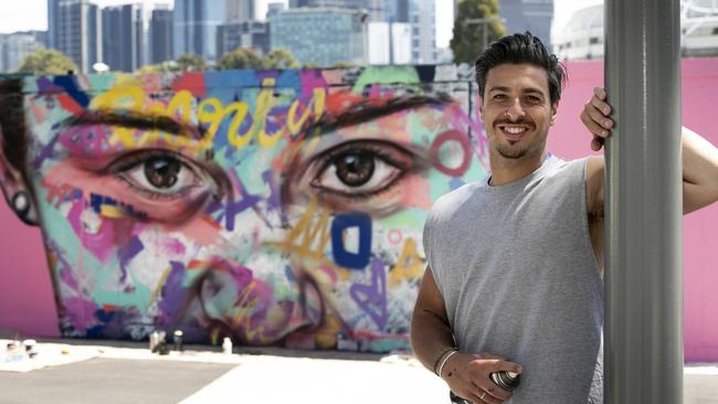 Monty AKA Paink with his finished mural of Ash Barty during Day 7 of the Australian Open at Melbourne Park Picture: Tennis Australia/Fiona Hamilton