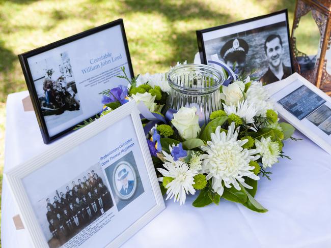 Photos and flowers at the memorial.