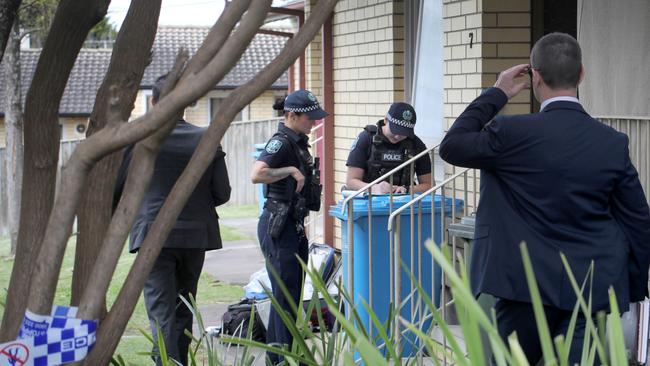 Police examine the scene of the alleged murder at a group of Mount Gambier units. Picture Dean Martin