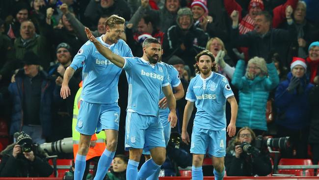 Jonathan Walters of Stoke City (19) celebrates with team mates after scoring.