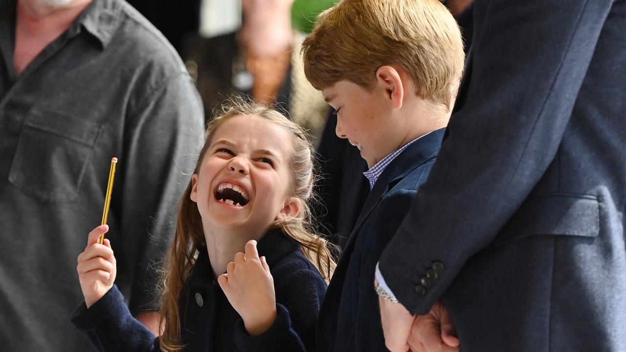 And then Charlotte did too as brother Prince George of Cambridge smiled at her giggling. (Photo by Ashley Crowden – WPA Pool/Getty Images)