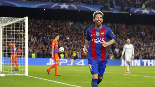 Barcelona's Lionel Messi celebrates after scoring his side's third.