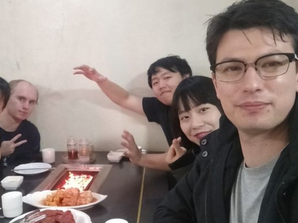 Alek Sigley and his wife Yuka (far right) with friends in Pyongyang. Picture: Twitter