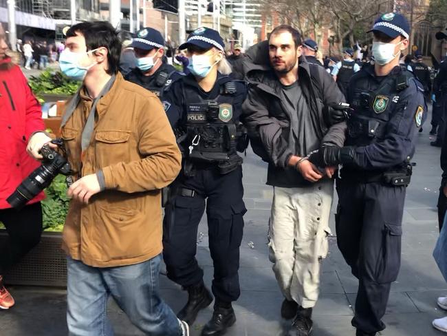 Another man taken away near Town Hall on Saturday.