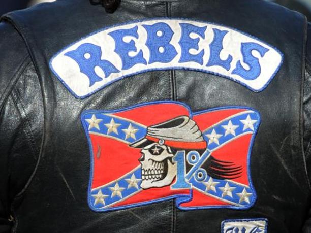 A Members of the Rebels MC joins members from 14 NSW outlaw motorcycle gangs at Moore Park as part of the United Motorcycle Council for a Legalise Freedom ride, Sydney, Saturday, June 13, 2009. The clubs represented were Hells Angels, Bandidos, Rebels, Comanchero, Nomads, Finks, Black Uhlans, Vietnam Veterans, Phoenix, Grave Diggers, Outcasts, Life and Death, Gods Squad and Bikers for Christ. (AAP Image/Dean Lewins) NO ARCHIVING, INTL OUT