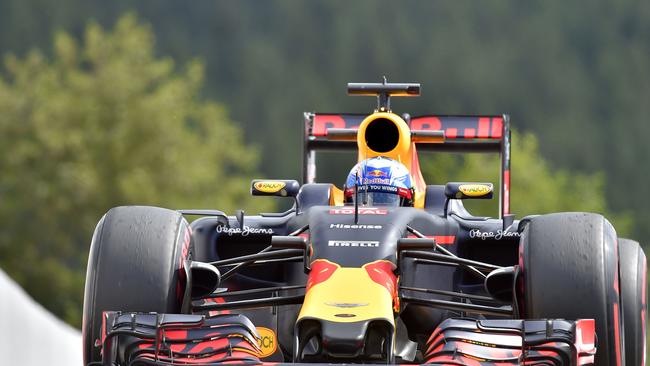 Red Bull Racing's Australian driver Daniel Ricciardo drives his car in the pits.