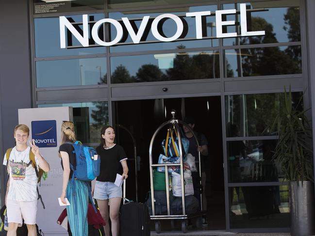 People leaving Novotel hotel after forced quarantine after arriving back to Australia after borders were closed due to Covid-19. Novotel Brisbane Airport, 6/8 The Cct, Brisbane Airport, Brisbane, 13th of April 2020. (AAP Image/Attila Csaszar)