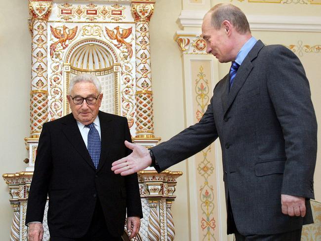 Russian President Vladimir Putin (R) welcomes former US Secretary of State Henry Kissinger during their meeting outside Moscow in 2006. Picture: AFP