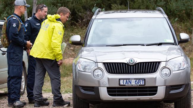 Police inspecting the couple’s car on Sunday, which was located in a carpark at the end of Reservoir Rd. Picture: Sarah Matray