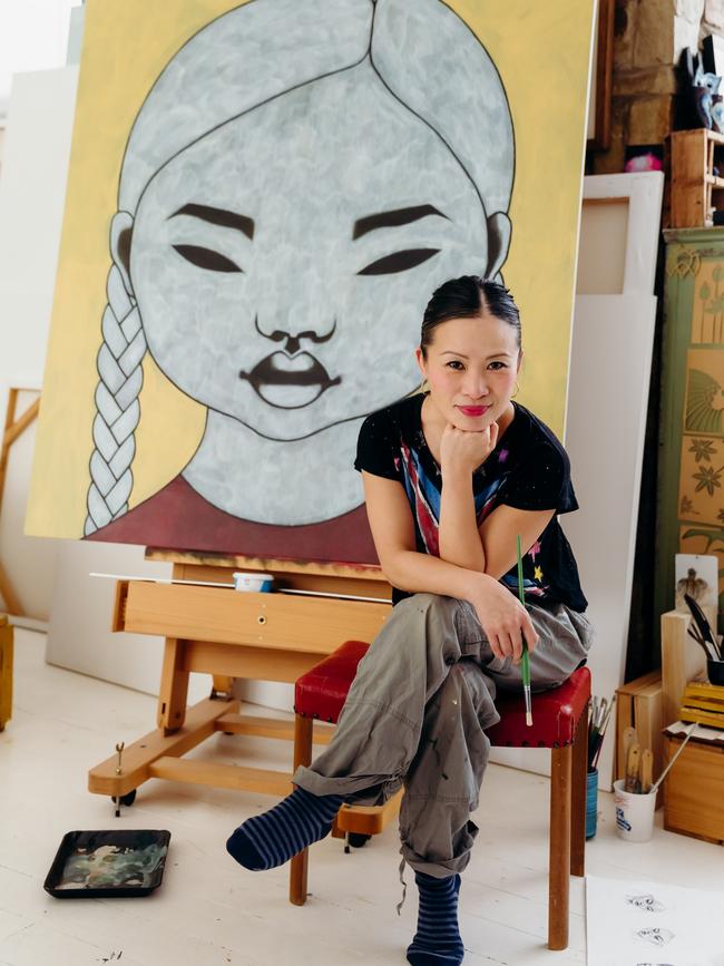 Poh Ling Yeow with one of her paintings featuring The Girl.