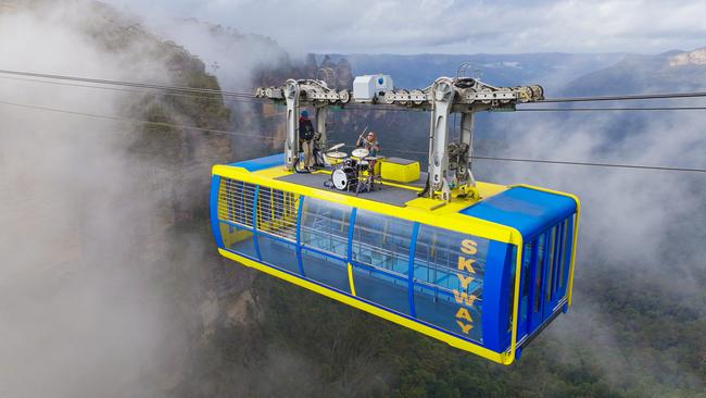 Australian musician G Flip performs The Worst Person Alive atop a cable car suspended 270m above the Blue Mountains near Katoomba. Picture: Getty Images