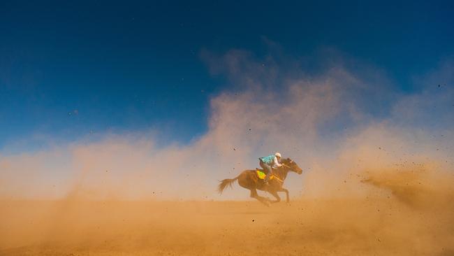 Last Place at Brunette Downs: The last place runner at the Northern Territory's oldest race meeting on Brunette Downs Station. Picture: Glenn Campbell