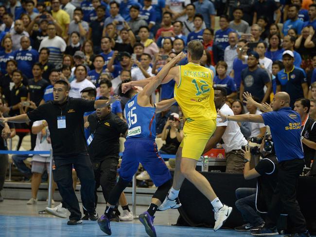 Kickert was then set upon by opposition players. (AFP PHOTO/TED ALJIBE)