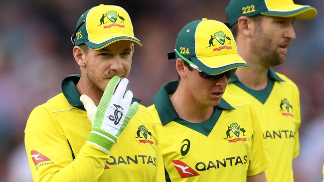 Australian captain Tim Paine leaves the field with team-mates after England’s innings. Picture: Getty