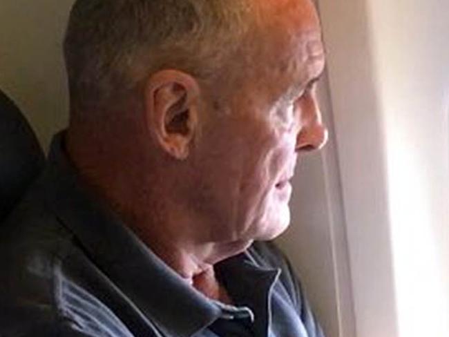 Chris Dawson is seen on his flight to Sydney from Queensland, Thursday, December 6, 2018. Mr Dawson is being extradited to NSW where he is expected to be charged with the murder of his wife Lynette Dawson who disappeared in 1982. Picture: Seven News