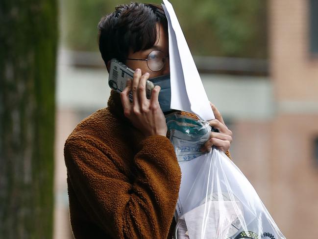 Trung Bao Le leaves Surry Hills Police Station after being charged with stealing $50k worth of handbags. Picture: Sam Ruttyn