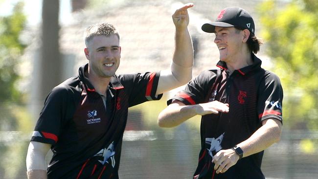 Tom O’Donnell and Cam McClure celebrate a wicket. Picture: Hamish Blair