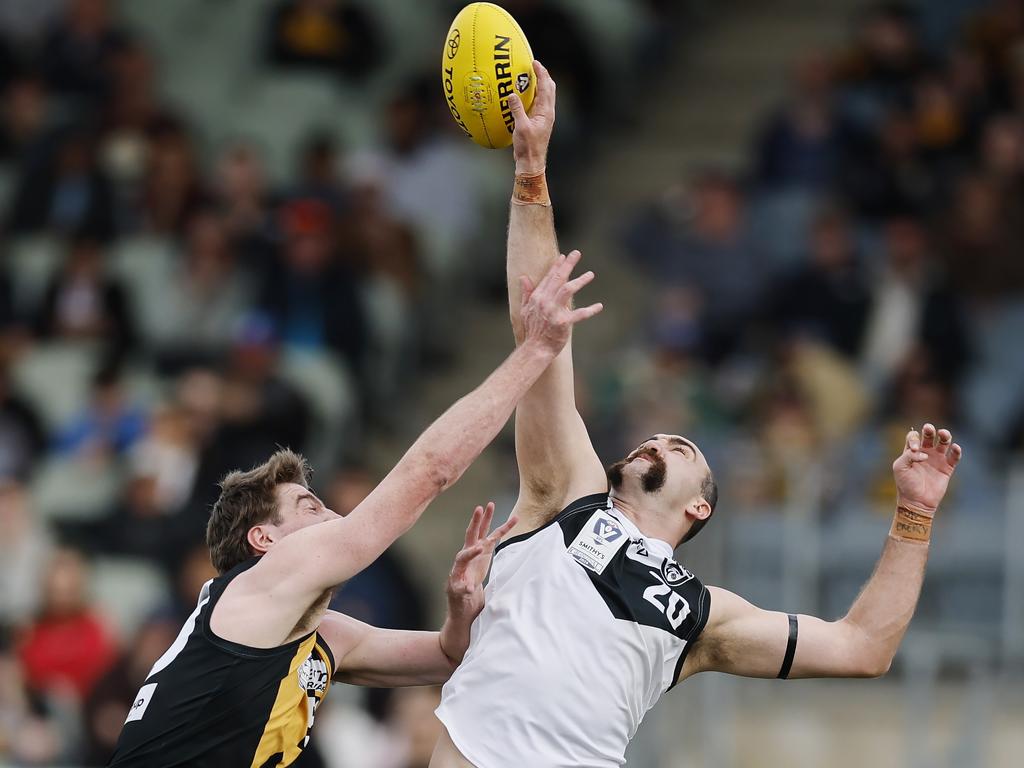 Werribee vs. Southport at Ikon Park, VFL grand final. Southport ruckman Brayden Crossley wins the ruck hit out over Sam Conway. Pic: Michael Klein.