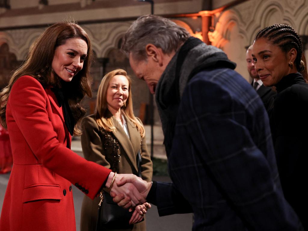 Catherine, Princess of Wales shakes hands with Richard E. Grant during the 'Together At Christmas' Carol Service at Westminster Abbey. Picture: Isabel Infantes-WPA Pool/Getty Images