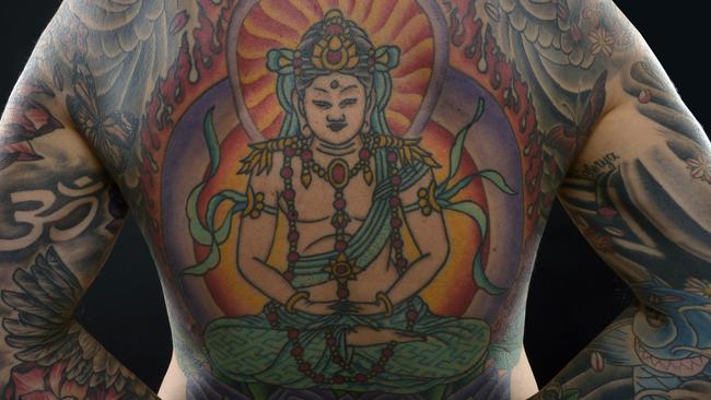 Award winning Perth architect hides spectacular Buddha tattoos | Daily  Telegraph