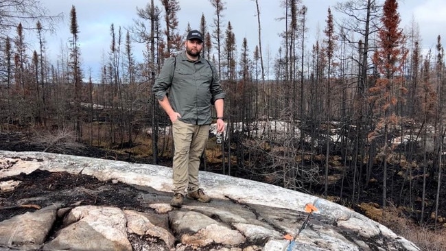 James Bay Minerals CEO Andrew Dornan standing on top of the Warhawk pegmatite. Picture: JBY