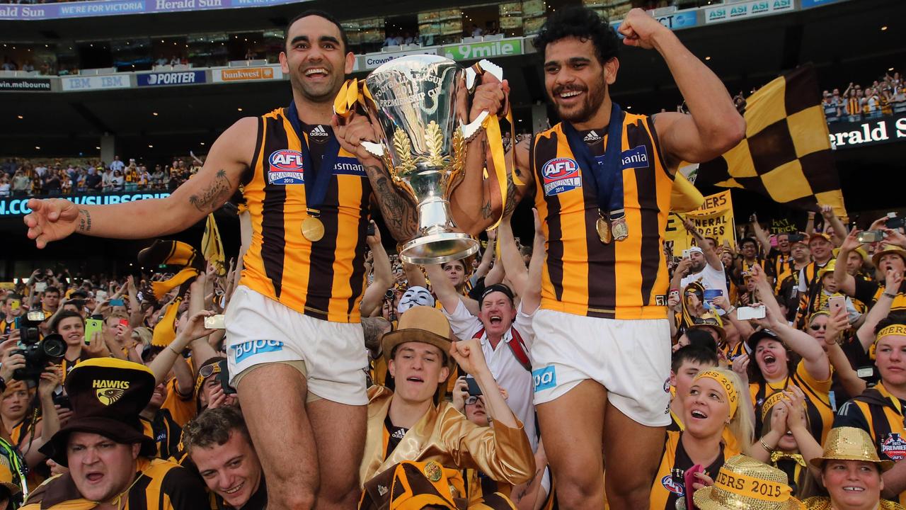 Burgoyne and Cyril Rioli among fans with the 2015 premiership cup. Picture: Alex Coppel